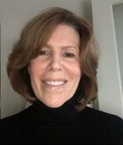 Happy woman volunteering at Catholic Community Services.